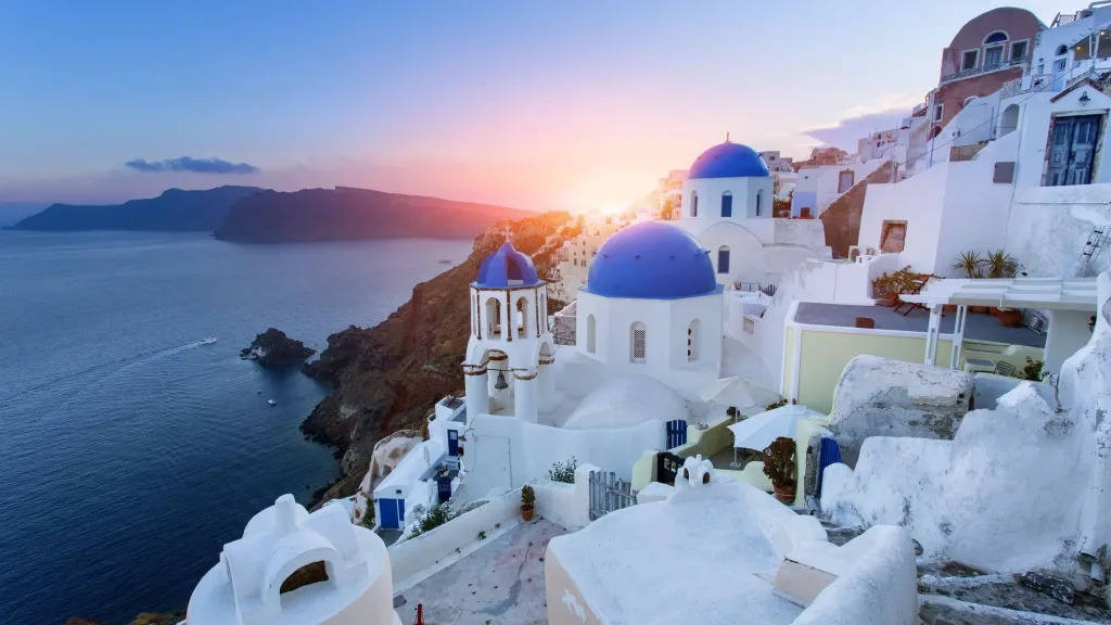 Blue domed churches at sunset, Oia, Santorini