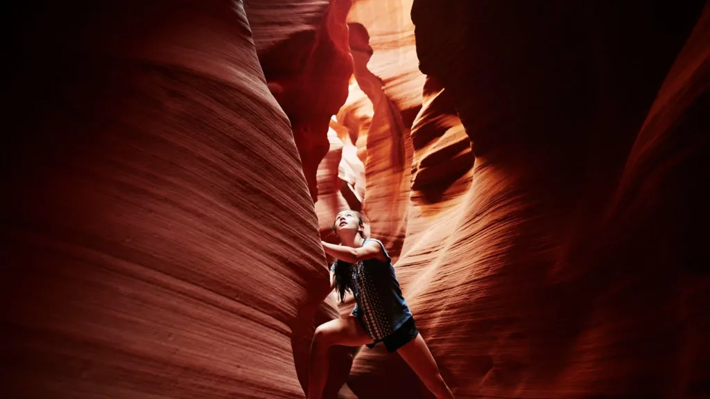 Girl in slot Antelope Canyon. Surreal Places on Earth.